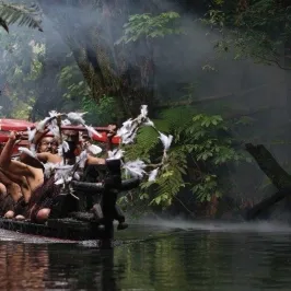 a person sitting on top of a river