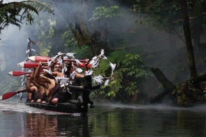 a person sitting on top of a river