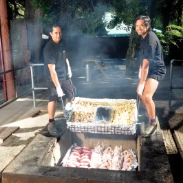 a man cooking on a grill