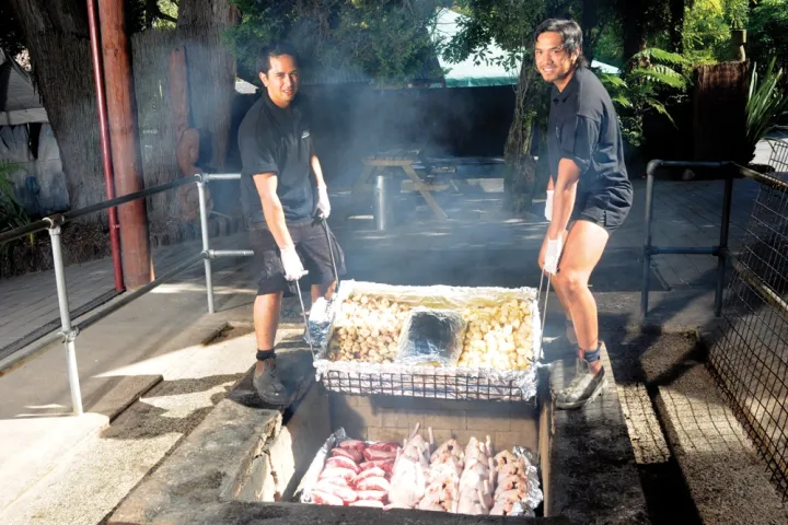 a man cooking on a grill