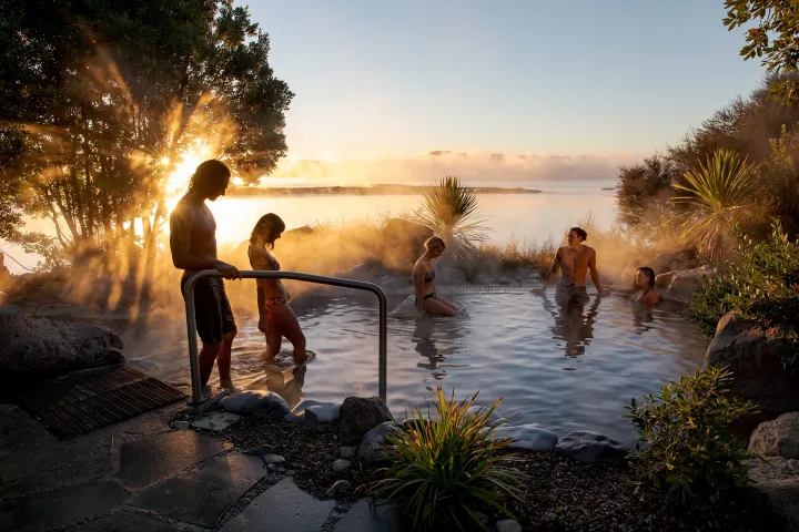 a group of people that are standing in the water