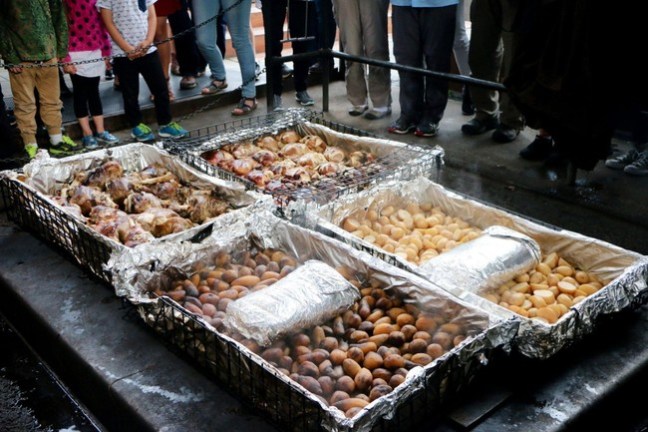 a group of people preparing food inside of it